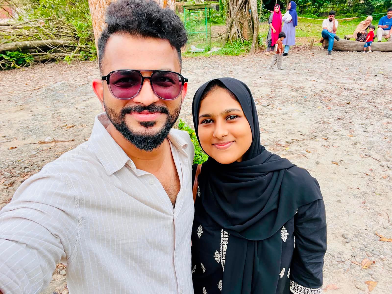 Fayiz and Shakkira taking a selfie outdoors
